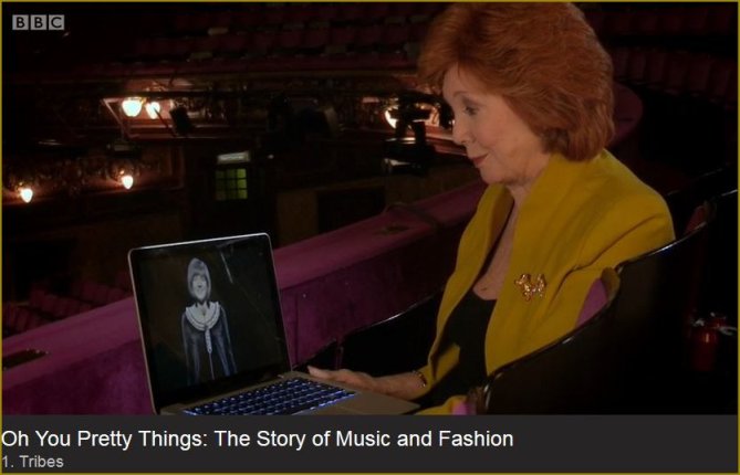 Cilla with lap top image of earlier self