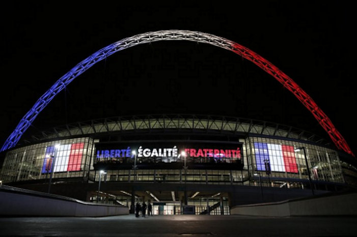 Wembley Stadium lit up in tricolour