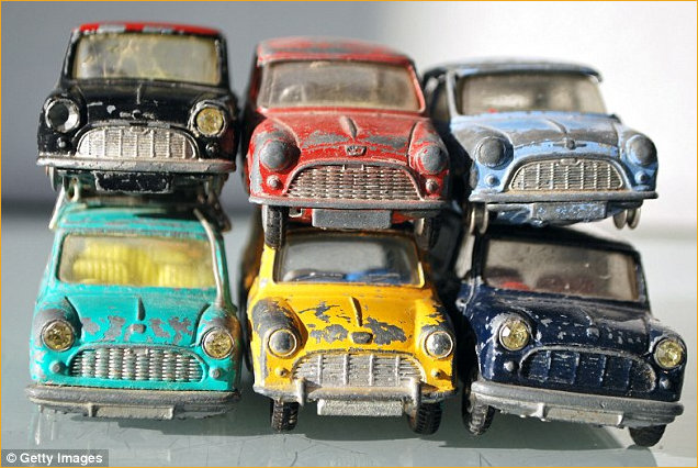 Rusted mini car toys used for article headline
