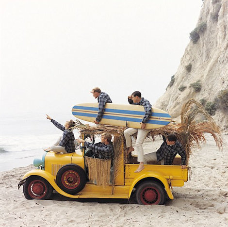 The Original Beach Boys including Dennis on the beach with surfboards