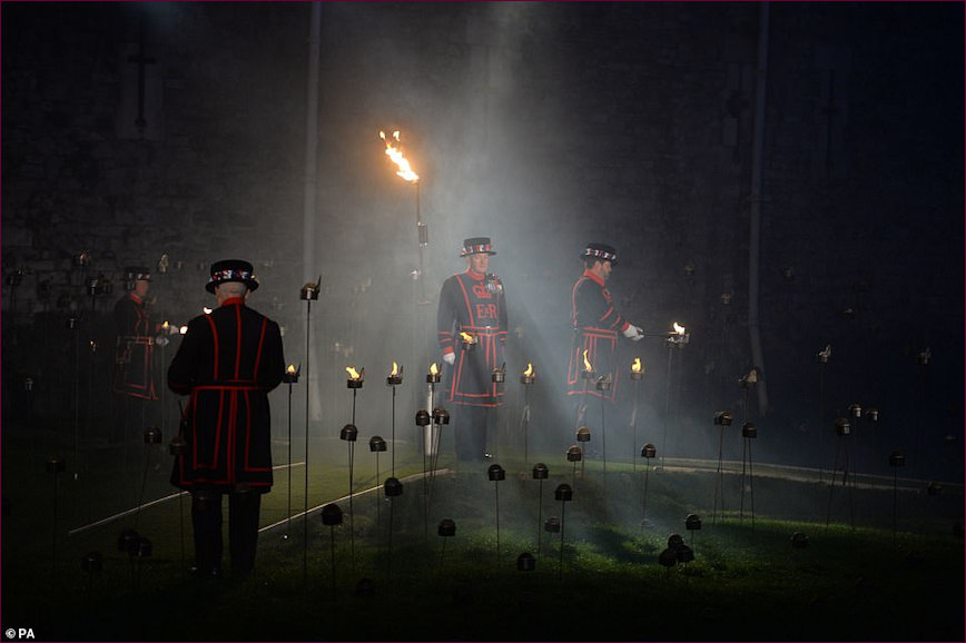 Three Beafeaters in position to hold vigil in the moat during lighting ceremony