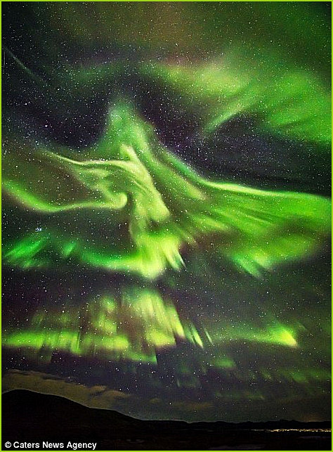 A Phoenix image appears in the skies during an Aurora Borealis show