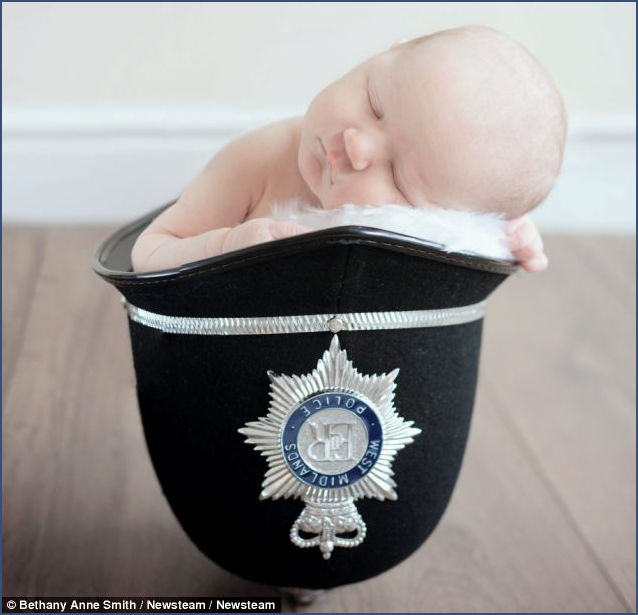 4 day old baby in Police Helmet
