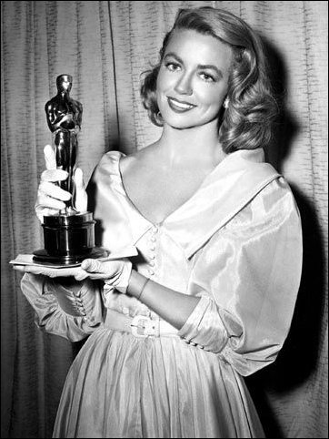 Dorothy Malone receiving Oscar in 1956