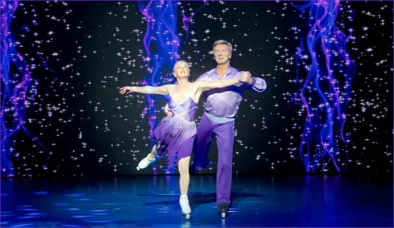 Torvill and Dean sporting purple in panto