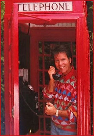 Sir Cliff Richard and a telephone kiosk pose for calendar
