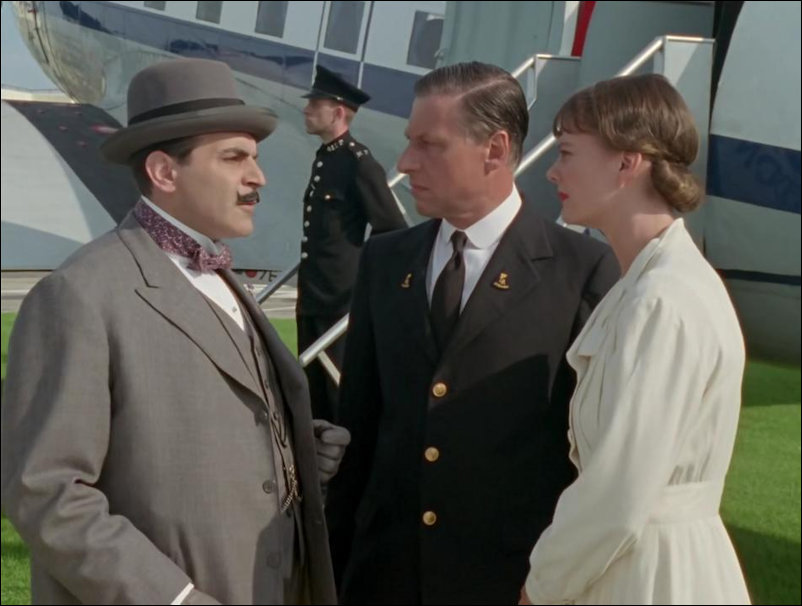 Action frame in front of Emoire Airways aeroplane used in Poirot