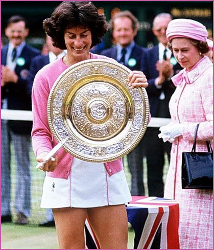 The Queen looks on as Virginia delights in her trophy in 1977