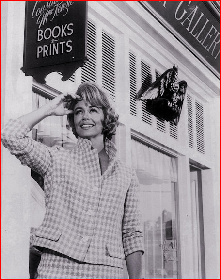 Dorothy Malone against a backdrop of her shop in Peyton Place