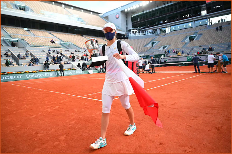 Iga at Roland Garros with Flag and Trophy and reduced spectators